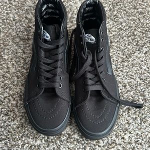 Brand new size 5.5 women’s all black high top vans. Never been worn.
